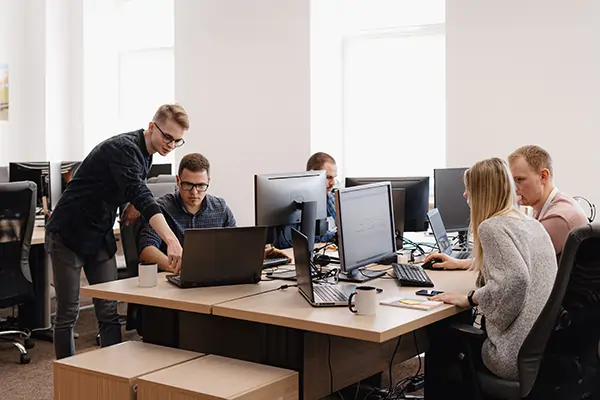 Group of young business people working in the Information Technology office managing projects under project management system
