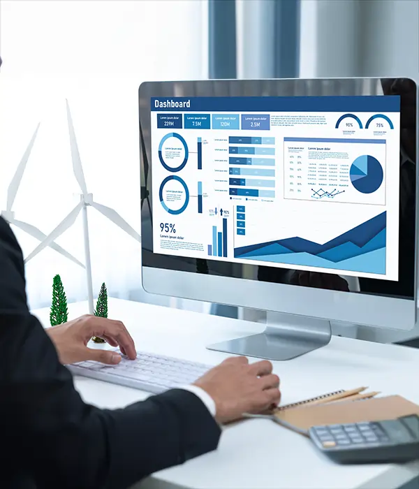 IT company manager viewing business data on an all-in-one IT management system dashboard with integrated business intelligence analytics.